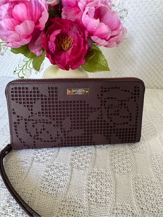 kate spade Handbags - Kate Spade NWOT laser cut plum STORYBOOK zip around wallet